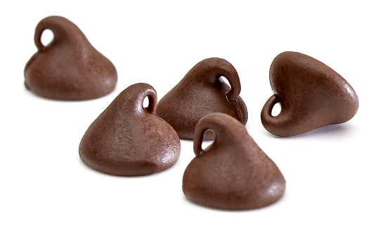 Chocolate morsels on white background