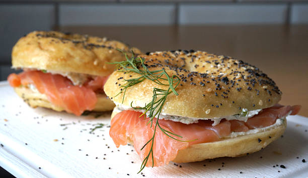 American bagels American bagels with smoked salmon, cream cheese and dill smoked salmon stock pictures, royalty-free photos & images