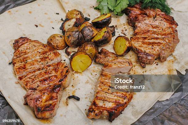 Grilled Steak Bacon And Potatoes Lies In The Pita Stock Photo - Download Image Now