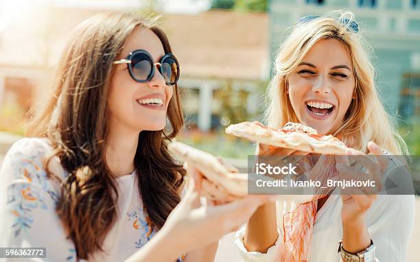 Friends Eating Pizza Stock Photo - Download Image Now - Pizza, Eating, Women