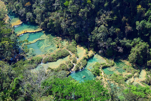 The magnificent turquoise waterfalls of Semuc Champey seen from the air, Guatemala.