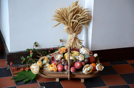 Portrush , Northern Ireland - October 20th, 2013. Picture shows a  Church Harvest decoration containing flowers fruits and wheat