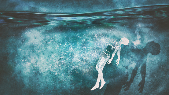 White ghostly body disintegrating underwater