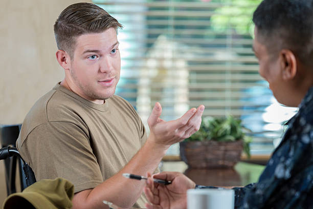 istock Soldier being evaluated by military counselor or doctor 596374220