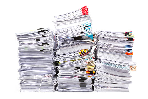 istock Stack of business papers isolated on white background 596375088