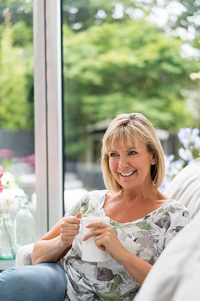 istock Senior woman relaxing at home 596375542