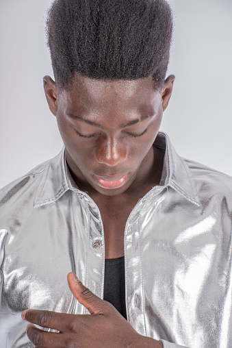 Young Black African Man Looks Down To Admire His Jacket Stock Photo - Download Image Now - iStock Young Black African Man Looks Down To Admire His Jacket Stock Photo - Download Image Now - iStock