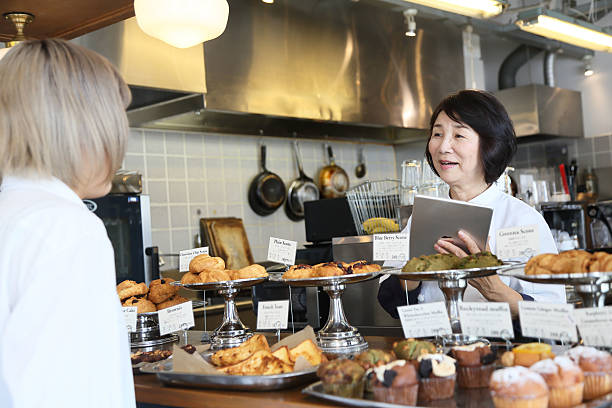 istock The manager who receives orders with a tablet 596378470