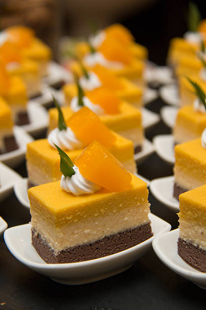 istock cut mini orang cheese cake  in mni white cup 596384640