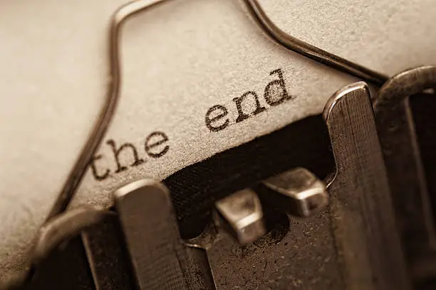 Photo of The end, words written on old vintage typewriter