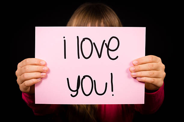 istock Child holding I Love You sign 596387048
