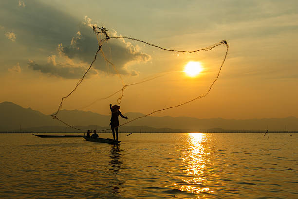 istock Fisherman , Silhouette fisherman. 596387146