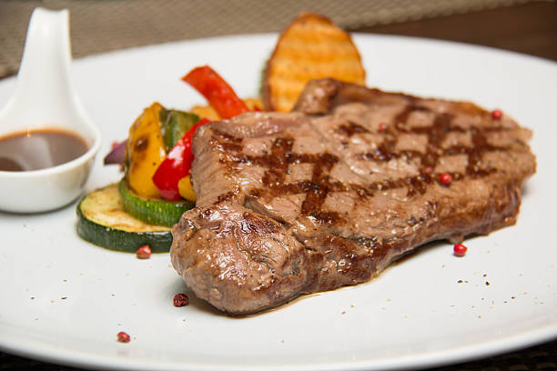 istock Sirloin steak and Grill vegetables 596387808