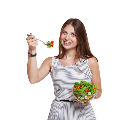 Close Up of Young Woman Eating Fruit Salad Isolated on White Background
