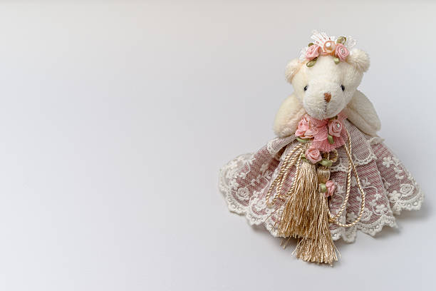 cream bear doll wear light pink dress use home decor.