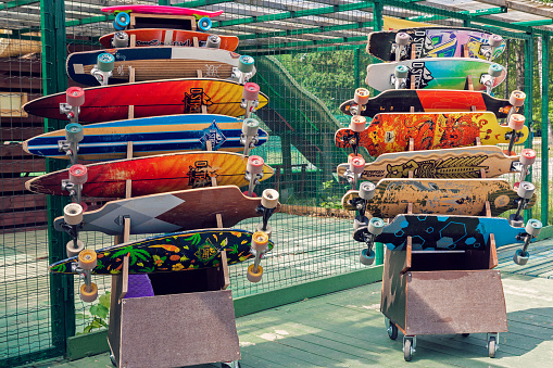Vilnius, Lithuania - May 29, 2016: Colorful longboards and skateboards for rent in skateboarding park outdoors in Vilnius, Lithuania.
