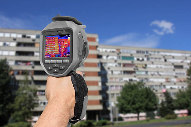 istock Recording Residential Buildings With Thermal Camera 596390316