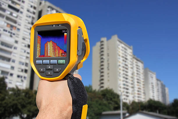 istock Recording Residential Buildings With Thermal Camera 596390354