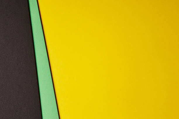 istock Colored cardboards background in black green yellow tone. Copy s 596390886