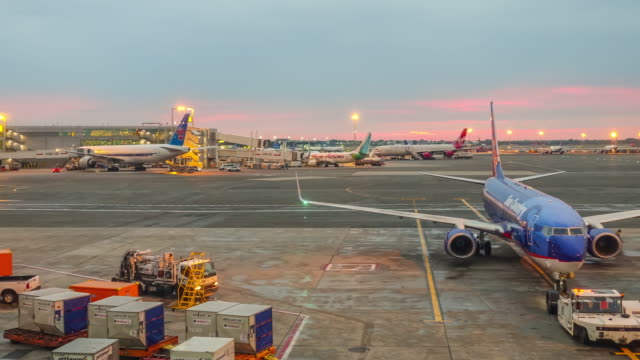 Time lapse of sunrise and busy airport at JFK