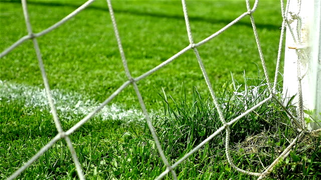 Slow motion of football soccer ball goal into net