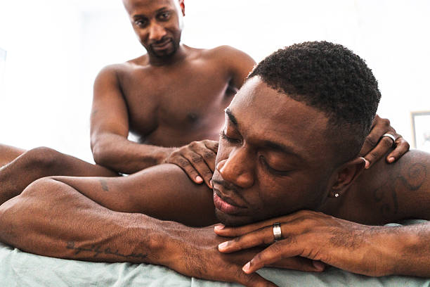istock homosexual couple relaxing togetherness and sharing a massage 596767652