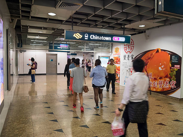 Chinatown MRT Train Station, Singapore Singapore, Singapore - March 22, 2016: Commuters are walking inside the Chinatown MRT station, ticketing areas are in the background. singapore mrt stock pictures, royalty-free photos & images