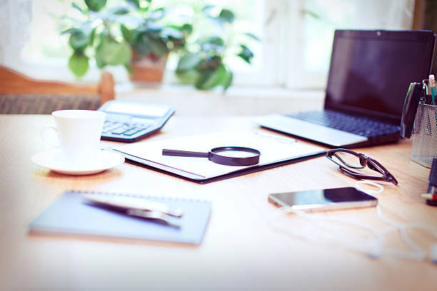 istock Office workplace with laptop and smart phone on wood table 596769576