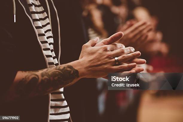People In The Theater Close Up Of Clapping Hands Stock Photo - Download Image Now - Applauding, Movie, Movie Theater