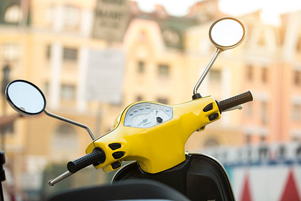 istock Steering wheel of yellow scooter. 596772024