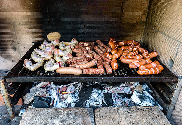 istock Mixed Meat on barbecue grill with coal. 596772938