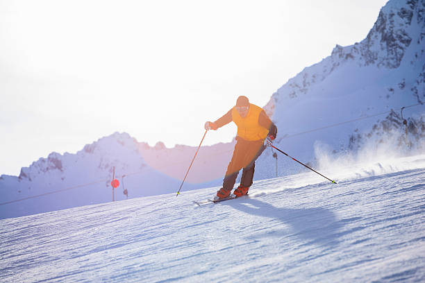 istock Men snow skier skiing on sunny ski resorts 596773290