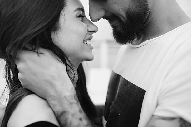 istock man and woman looking at each other 596773774