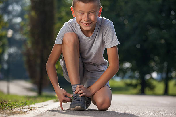 istock So cute boy smiling and preparing for running 596774020
