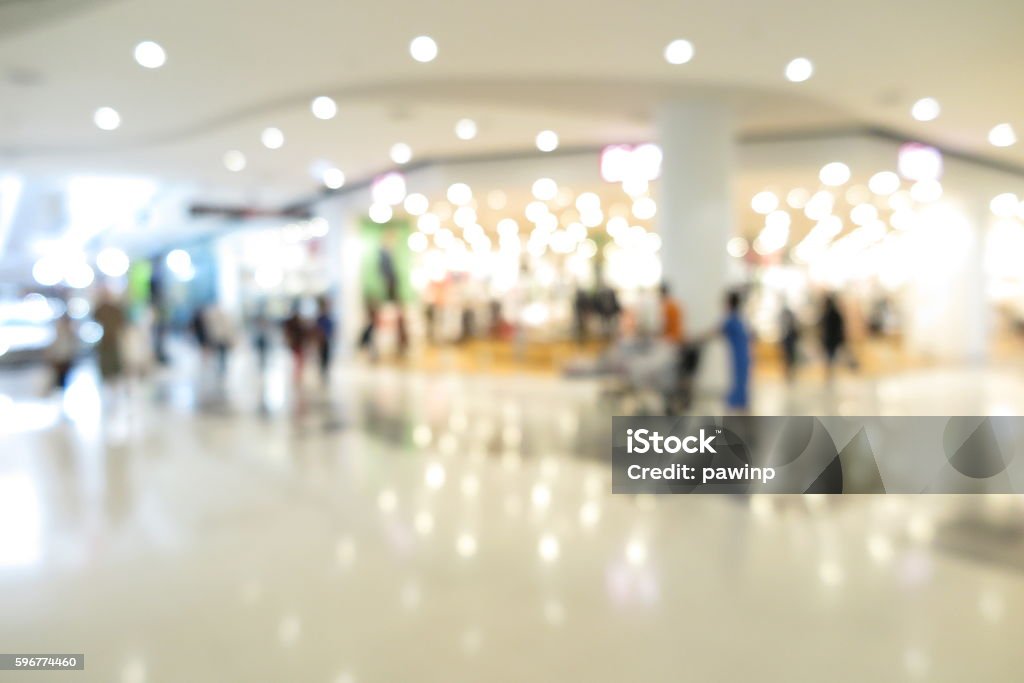 Shopping mall, modern trade with people in blur background Shopping Mall Stock Photo