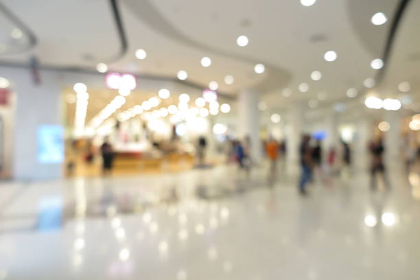 istock Shopping mall interior with people in blur background 596774546