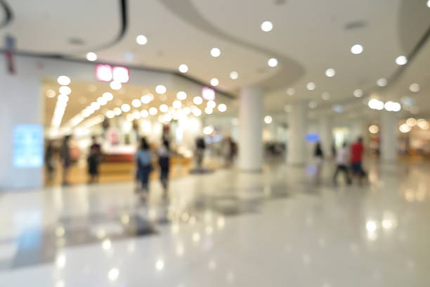 istock Shopping mall interior with people in blur background 596774578