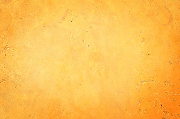 istock Yellow grunge wall for texture background 596775036