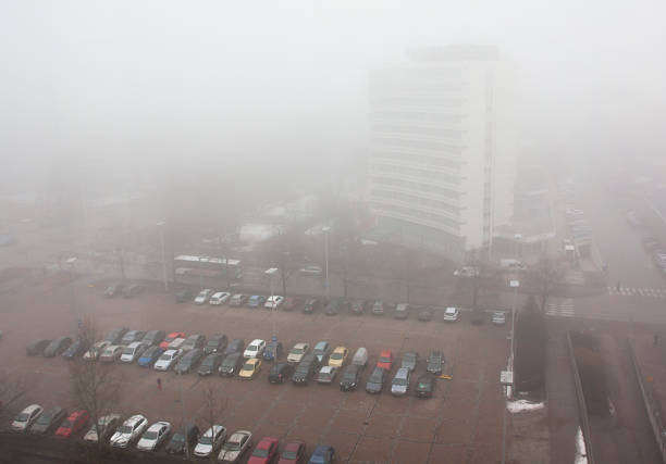 istock Car parking in the fog, top view 596776222