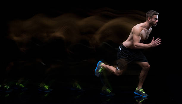 istock Multiple Exposure - Shirtless male runner running 596777096