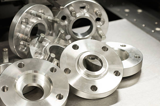 metal mold of wheel spacers and bolts. cnc industry - flange imagens e fotografias de stock