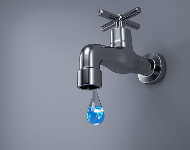istock Save water concept with metallic faucet 596780378