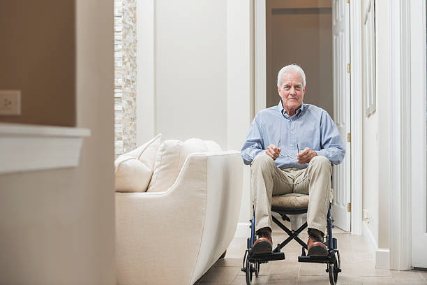 istock Senior man at home in a wheelchair 596780540