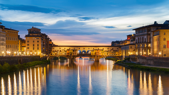 Ponte Vecchio - the bridge market in the center of Florence, Tuscany, Italy at dusk