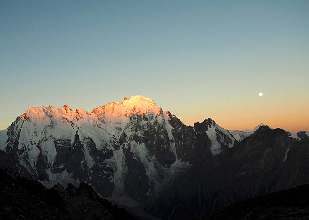 istock early morning. mountain peaks. dawn. moon 596782270