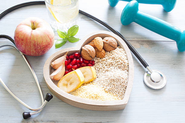 Healthy food in heart and water diet concept Healthy food in heart and water diet sport lifestyle concept manufactured object stock pictures, royalty-free photos & images