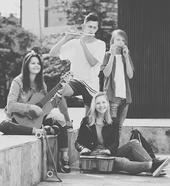 istock Young girls and boys with musical instruments 596784226