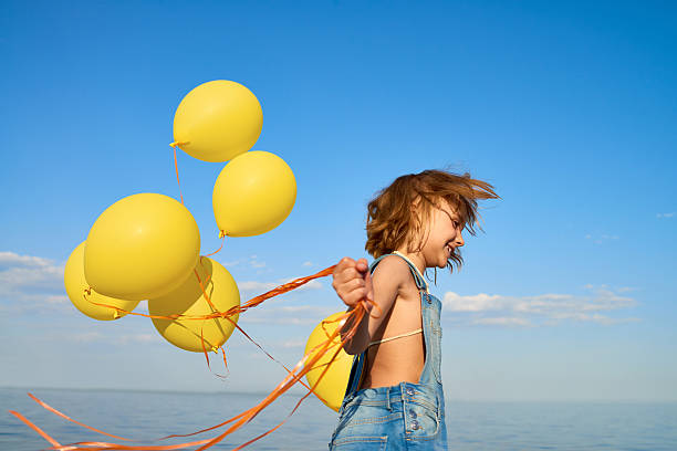 istock Little Girl Having Fun at Beach 596784340
