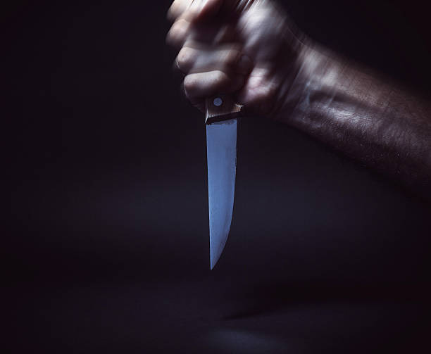 istock Male Hand Holding a Knife 596784690