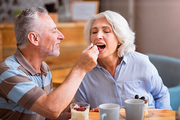 istock Pleasant senior couple sitting at the table 596785002
